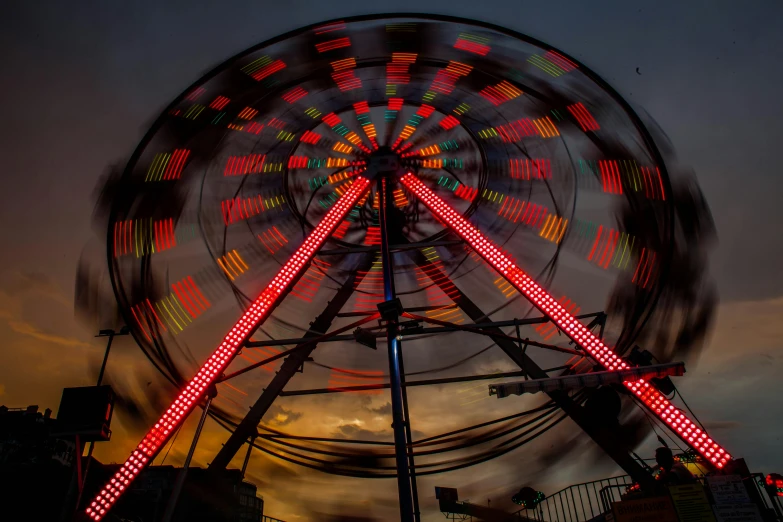 a ferris wheel spinning in the night sky, a portrait, by Matt Cavotta, pexels contest winner, kinetic art, red cloud light, by greg rutkowski, avatar image