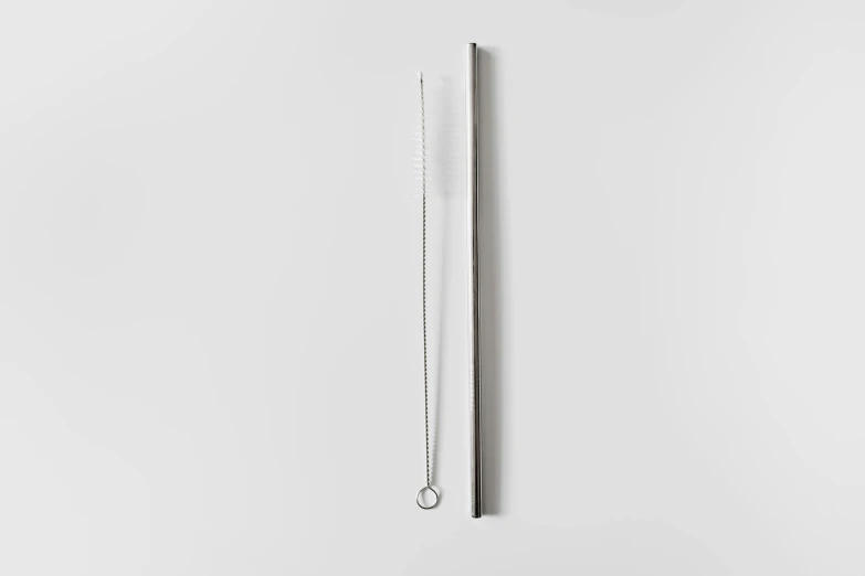 a pair of scissors sitting on top of a white surface, with a straw, hiroshi sugimoto, detailed product image, slim