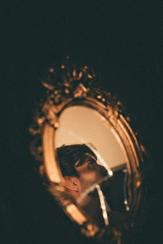 a man that is standing in front of a mirror, an album cover, by Elsa Bleda, renaissance, headshot profile picture, concert photo, looking into a mirror, gold framed