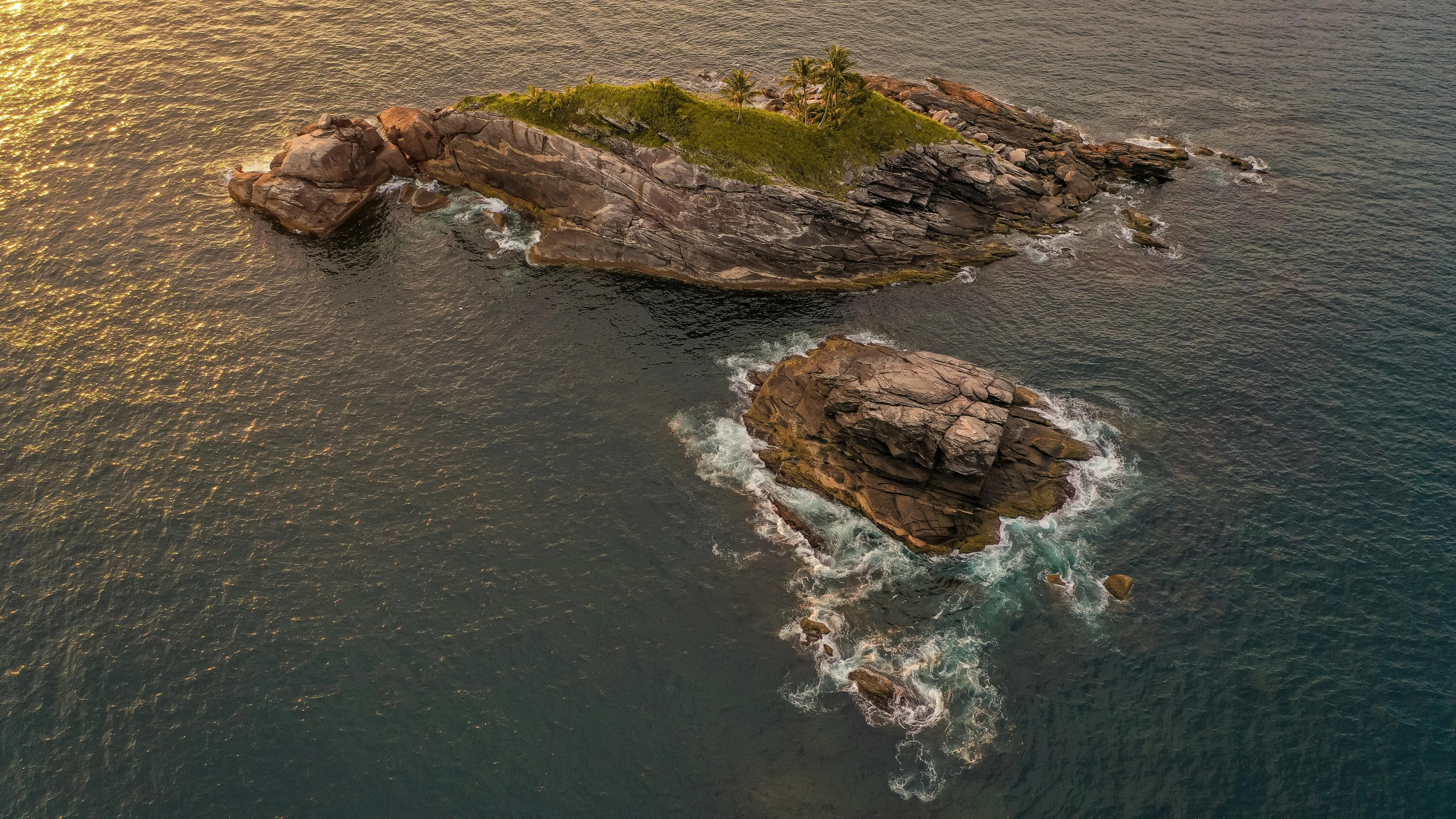 a small island in the middle of the ocean, by Max Dauthendey, pexels contest winner, process art, evening light, rock arcs, high - angle view, fine detail post processing