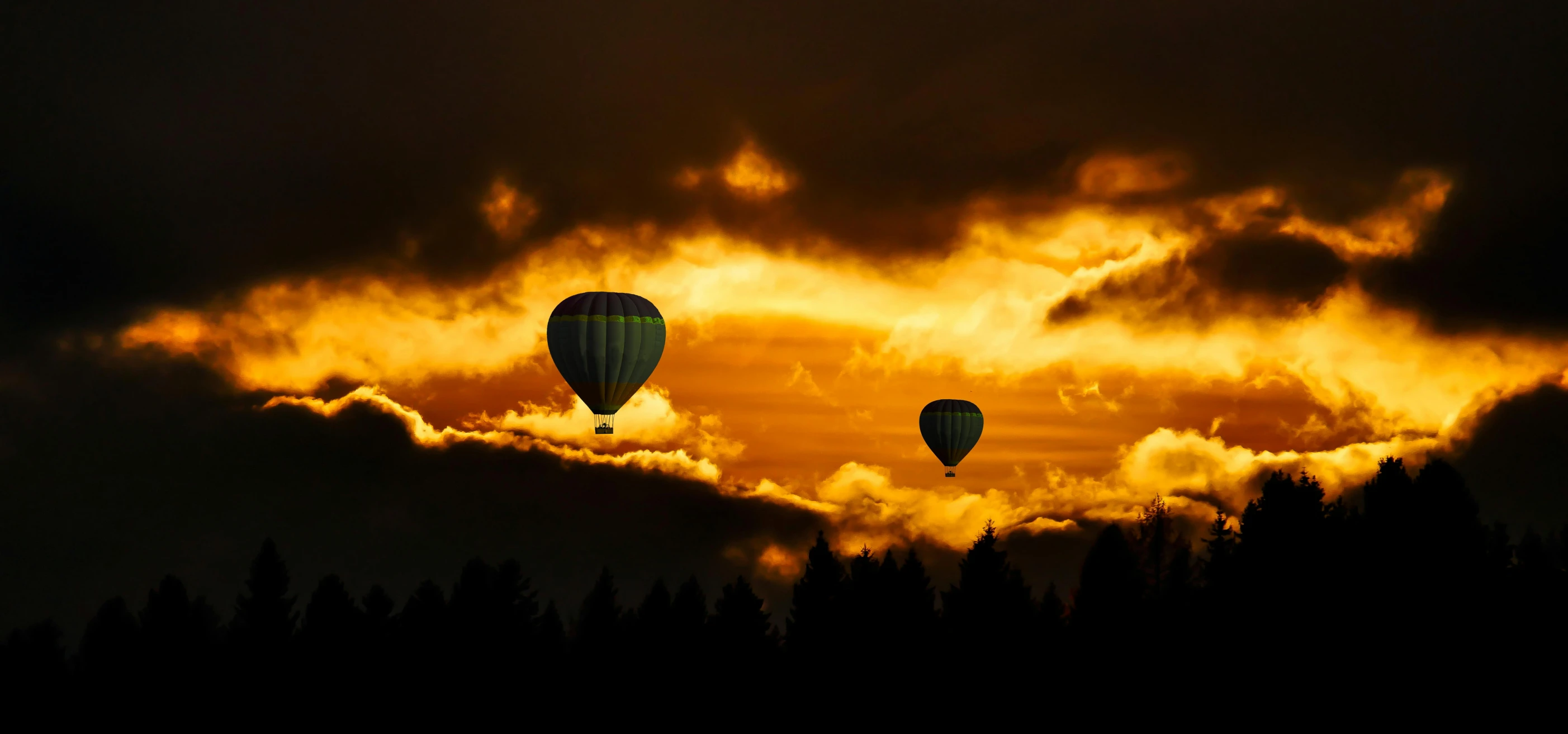 a couple of hot air balloons flying through a cloudy sky, by Jim Nelson, pexels contest winner, dappled golden sunset, yellow, ((sunset)), 8 k -