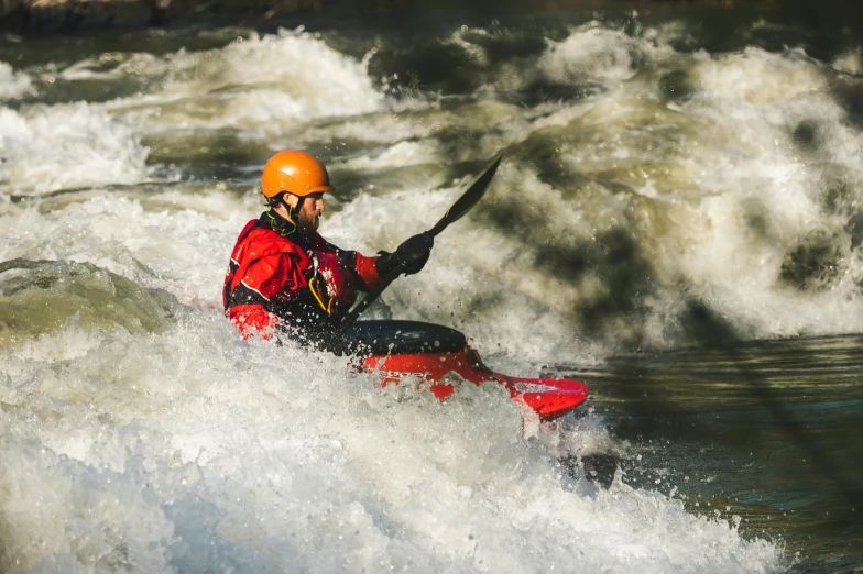 a man riding a wave on top of a red kayak, pexels contest winner, river rapids, avatar image, full frame image