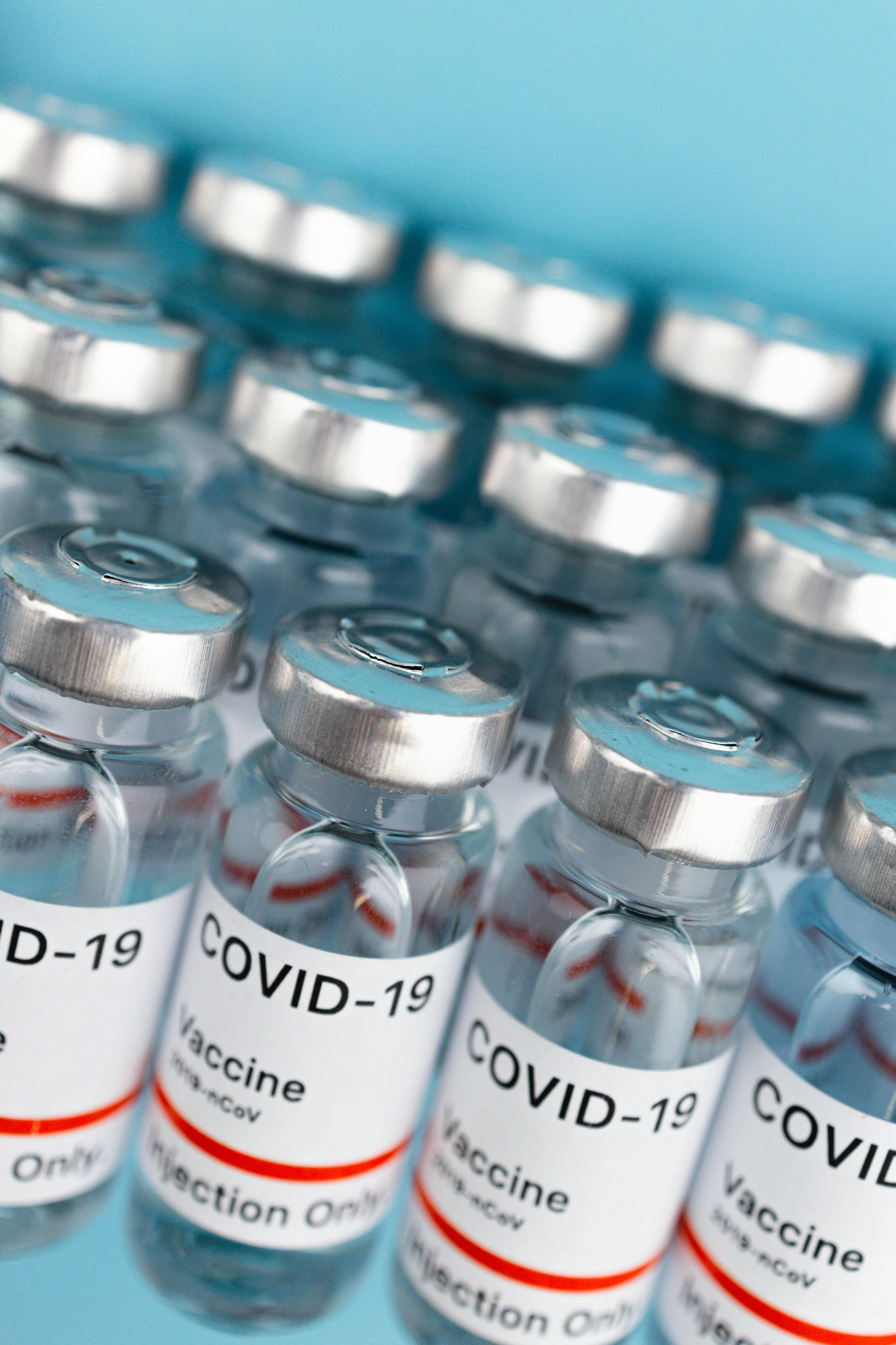 a row of vials filled with vaccines, covid, thumbnail, center of image, featured