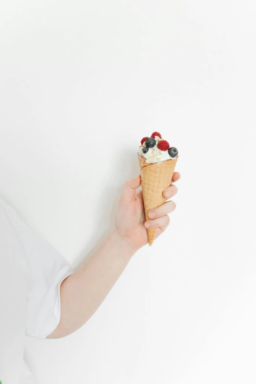 a close up of a person holding an ice cream cone, unsplash, cream white background, blueberry, 15081959 21121991 01012000 4k, petite