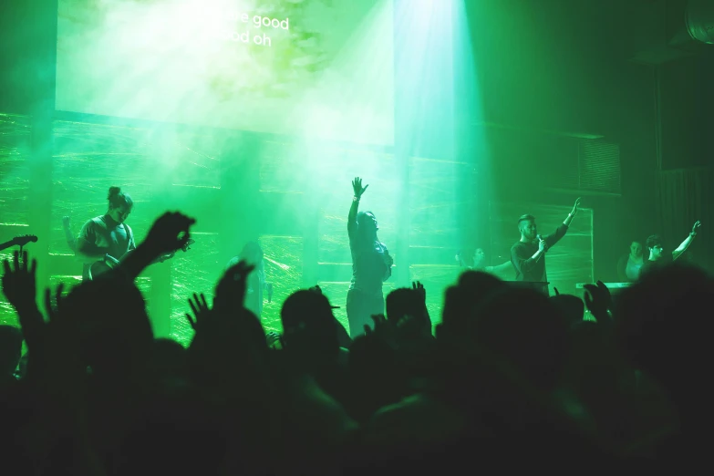 a group of people that are standing in front of a stage, pexels, happening, green light dust, jesus wasted at a party, thumbnail, standing inside of a church