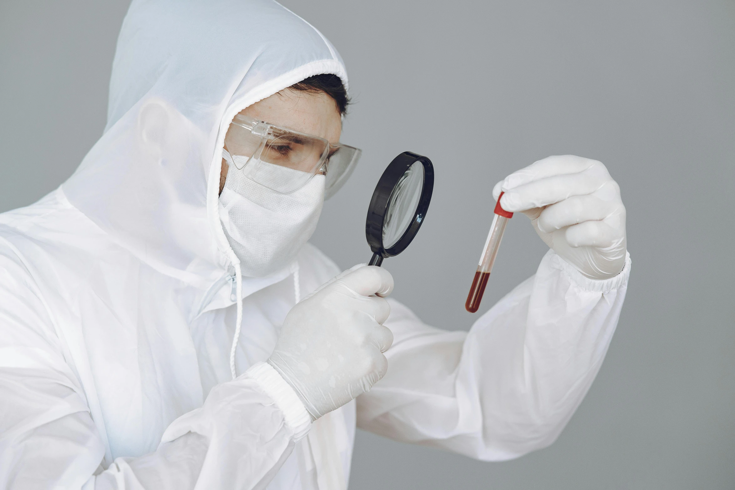 a man in a white lab coat holding a magnifying glass, an album cover, pexels contest winner, wearing white silk hood, blood collection vials, technical suit, avatar image