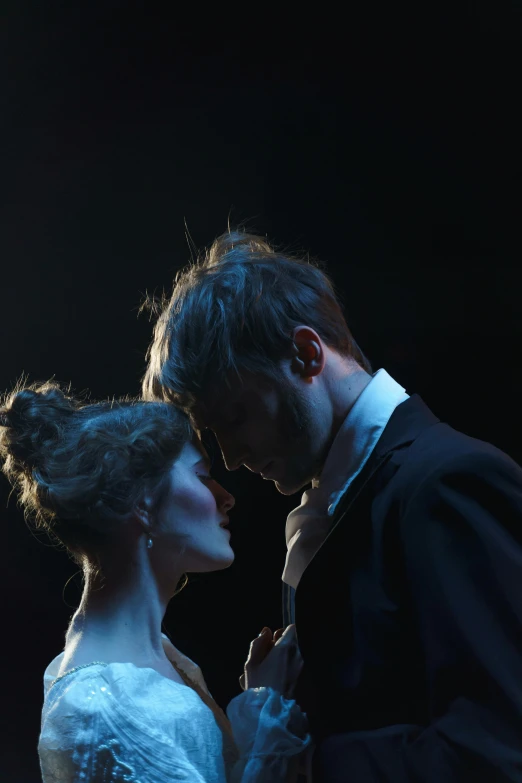 a man and a woman standing next to each other, a portrait, inspired by Ivan Kramskoi, flickr, neo-romanticism, theatrical lighting, profile image, production still, ( ( theatrical ) )