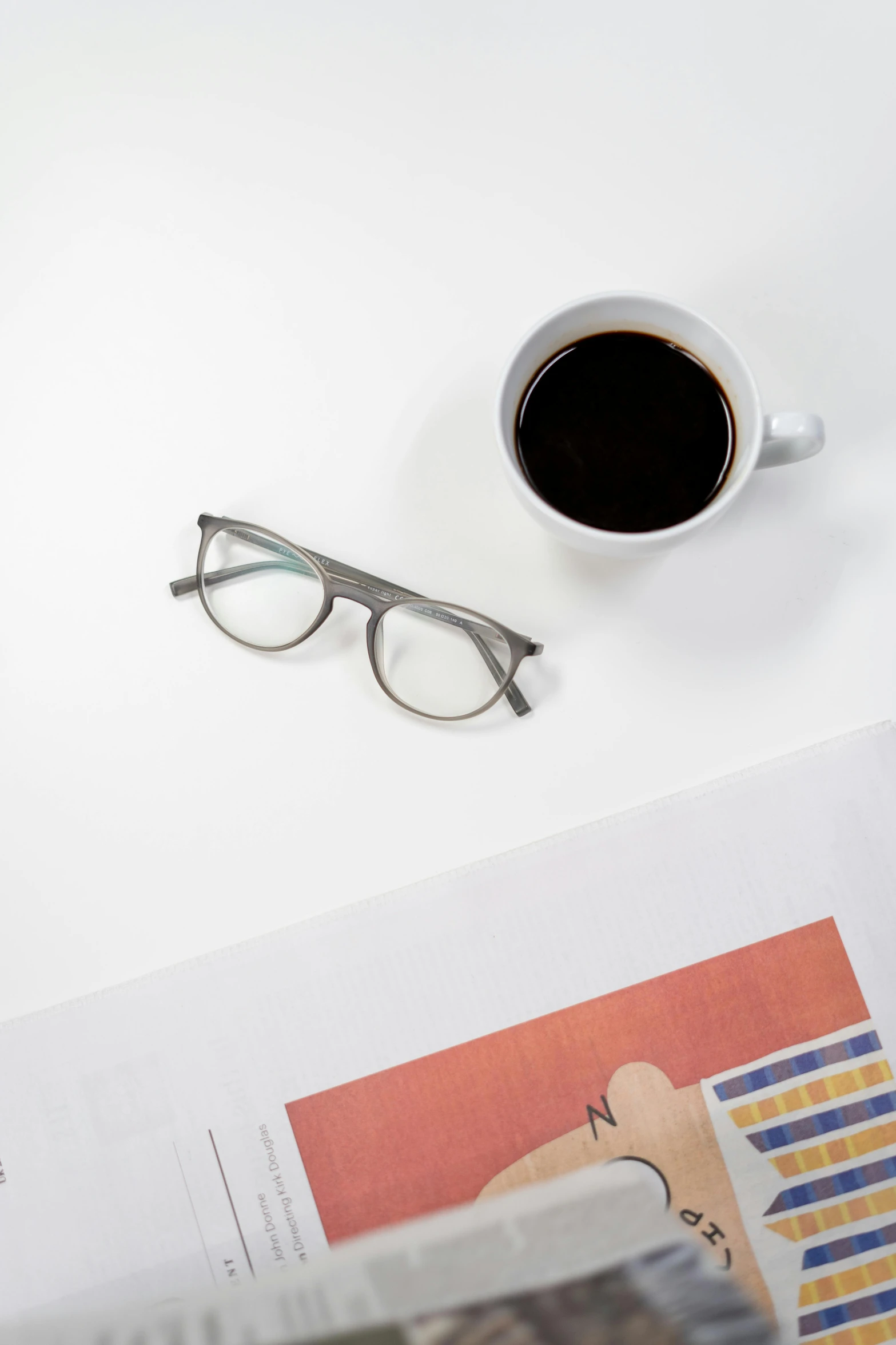 a laptop computer sitting on top of a desk next to a cup of coffee, a picture, by Harvey Quaytman, square glasses, shot with sony alpha, detail shot, high angle