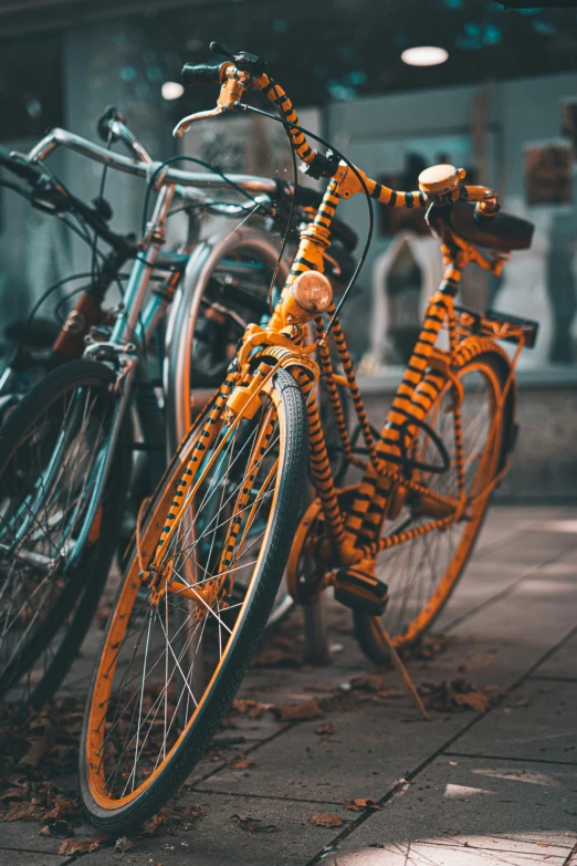 a couple of bikes parked next to each other, pexels contest winner, orange details, avatar image, patterned, low-light