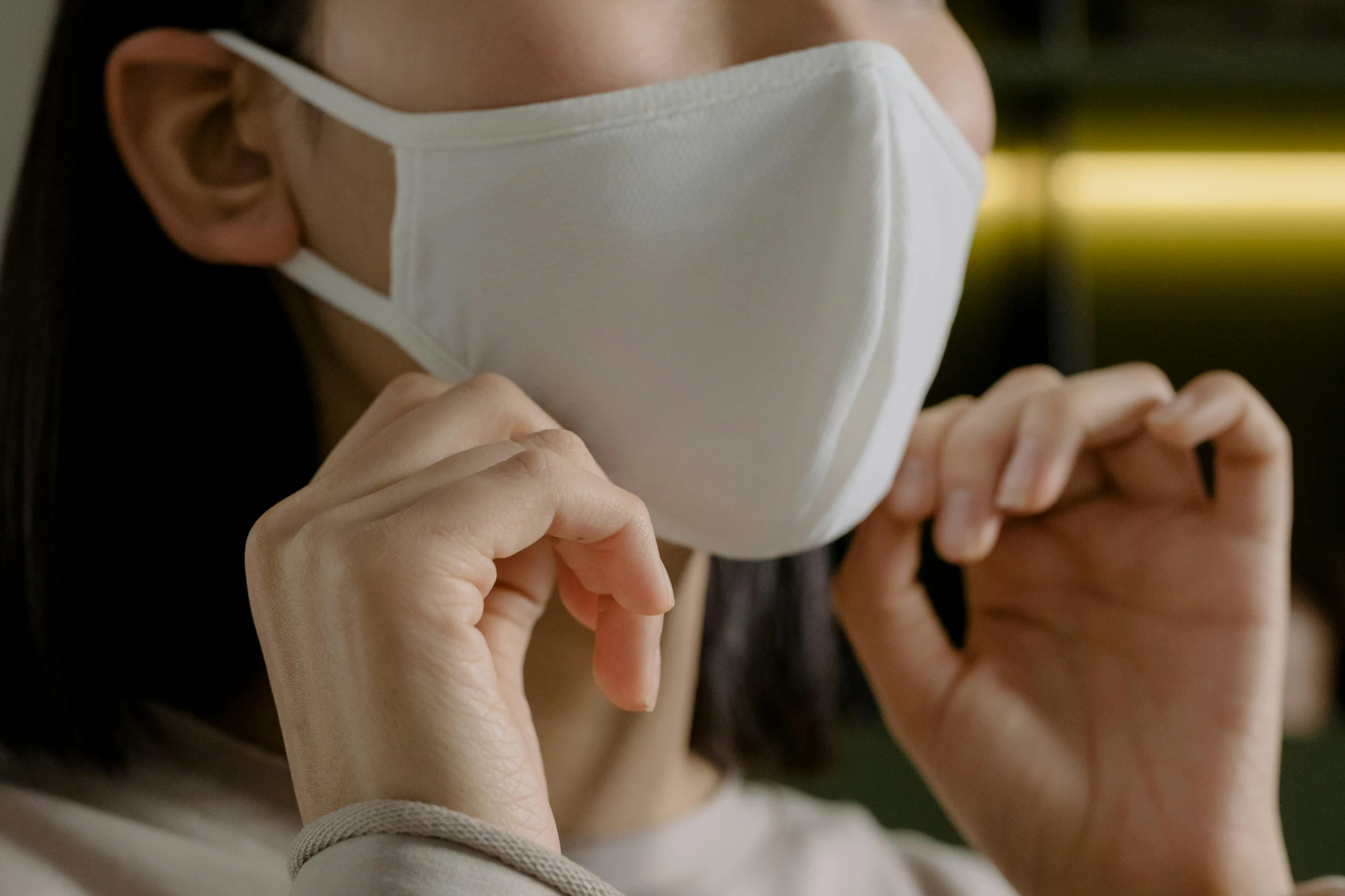 a close up of a person wearing a face mask, wearing a light shirt, easy to use, sensitive, the masks come off at night