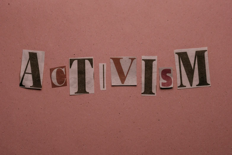 the word autism spelled in newspaper letters on a pink wall, inspired by Edward Ruscha, pexels contest winner, primitivism, cctv, action pose, brown, marina abramovic