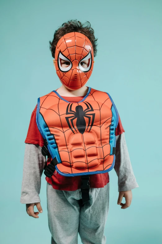 a young boy wearing a spider - man costume, by Nina Hamnett, body armor, official product photo, concern, aqua