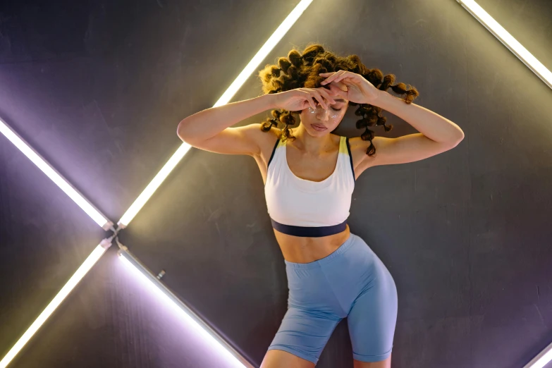 a woman in a white top and blue shorts, by Sam Charles, trending on pexels, light and space, strong neon lighting, avatar image, pixeled stretching, light skin