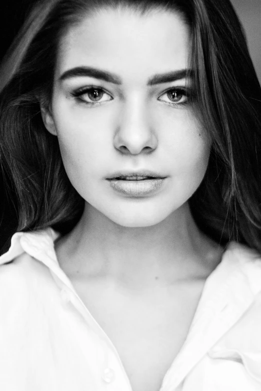 a black and white photo of a woman with long hair, a black and white photo, shutterstock, portrait sophie mudd, hailee steinfeld, cgsociety portrait, detailed and realistic faces