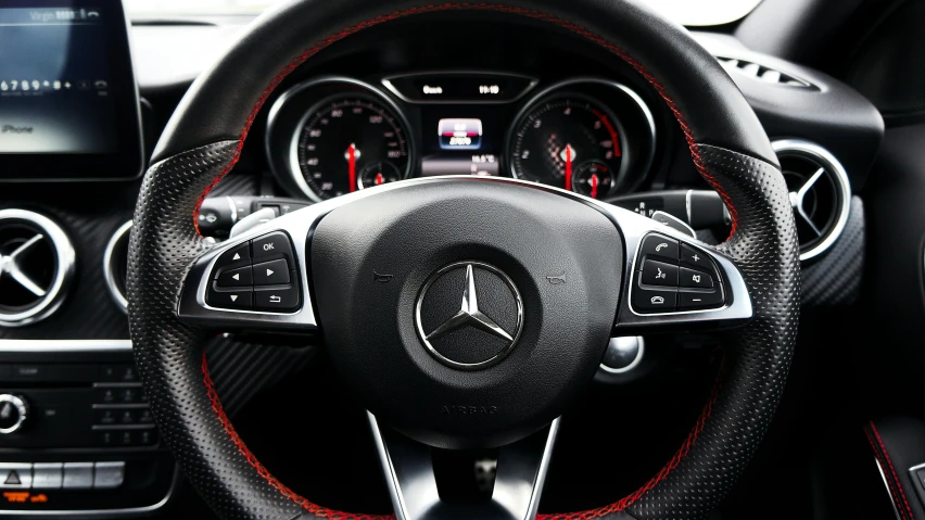 a close up of a steering wheel in a car, mercedez benz, red white and black color scheme, thumbnail, front on