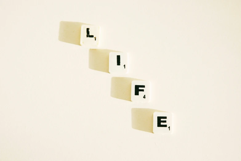 a number of cubes spelling life on a white surface, an album cover, unsplash, figuration libre, ffffound, wall art, gaming, 15081959 21121991 01012000 4k