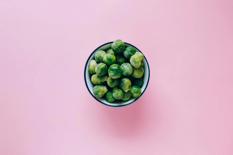 brussels sprouts in a bowl on a pink background, pexels, 🐿🍸🍋, subtle visual noise, 🍸🍋