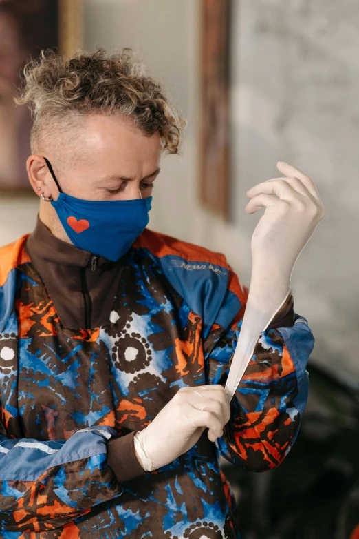 a man wearing a face mask and gloves, visual art, bleached, a blond, in a workshop, blue print