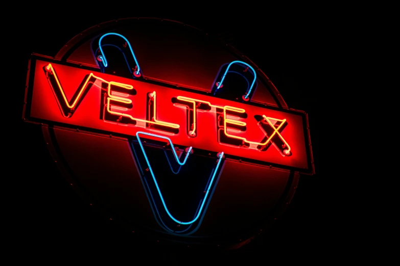 a neon sign with the word velttex on it, an album cover, pexels, weta fx, latex, wet fabric, noctilux 50mm