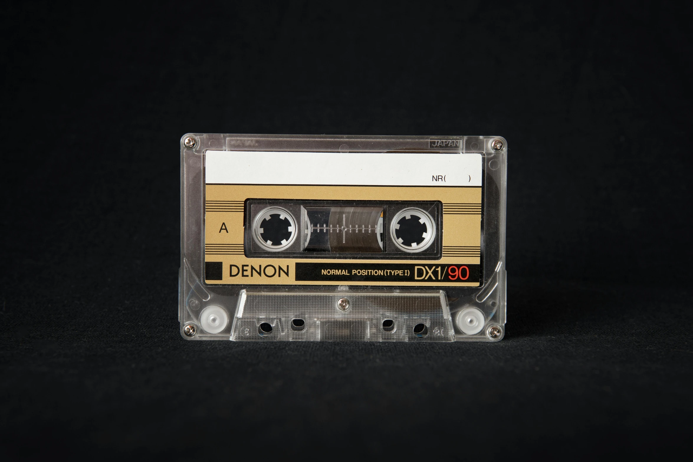 a close up of a cassette on a black background, an album cover, by Andries Stock, unsplash, serial art, demon days, lemon, highly detailed product photo, xenon