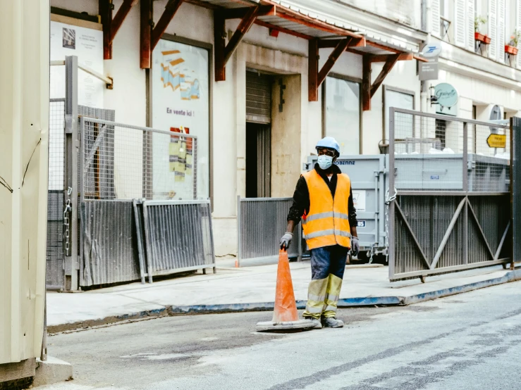 a person on a skateboard on a city street, by Julia Pishtar, pexels contest winner, arbeitsrat für kunst, yellow hardhat, cone, wearing plumber uniform, wearing facemask