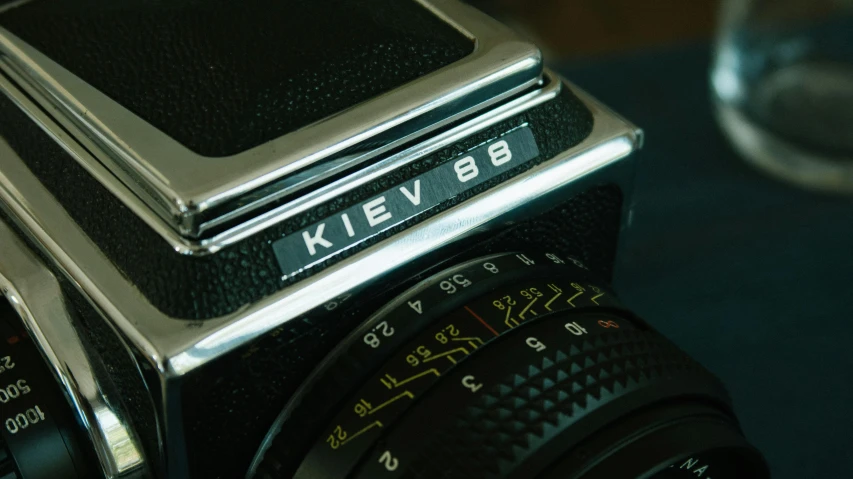 a close up of a camera on a table, an album cover, by Kev Walker, pexels contest winner, superb detail 8 k, avatar image, 80s photo, fadeev! 8 k