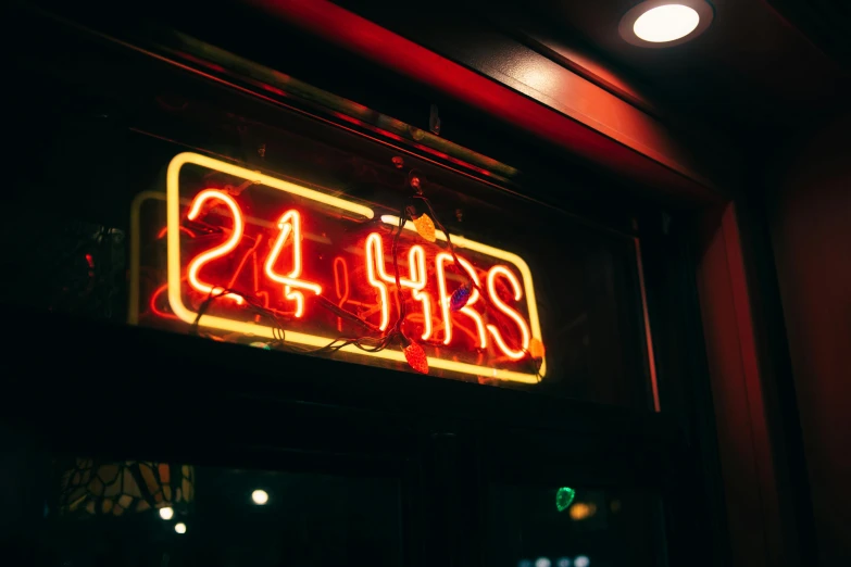 a neon sign hanging from the side of a building, unsplash, 2 4 years old, hour glass, busy night, 2 - minute tabletop