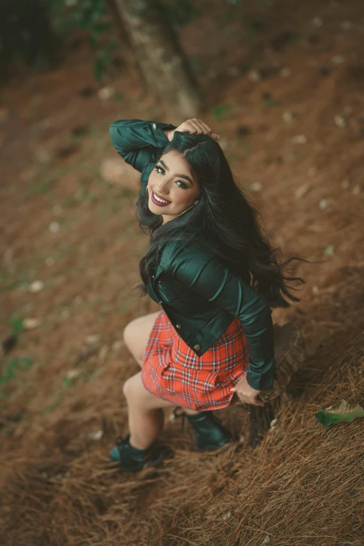 a woman posing for a picture in the woods, an album cover, pexels contest winner, hurufiyya, smiling girl, assamese aesthetic, wearing jacket and skirt, profile image