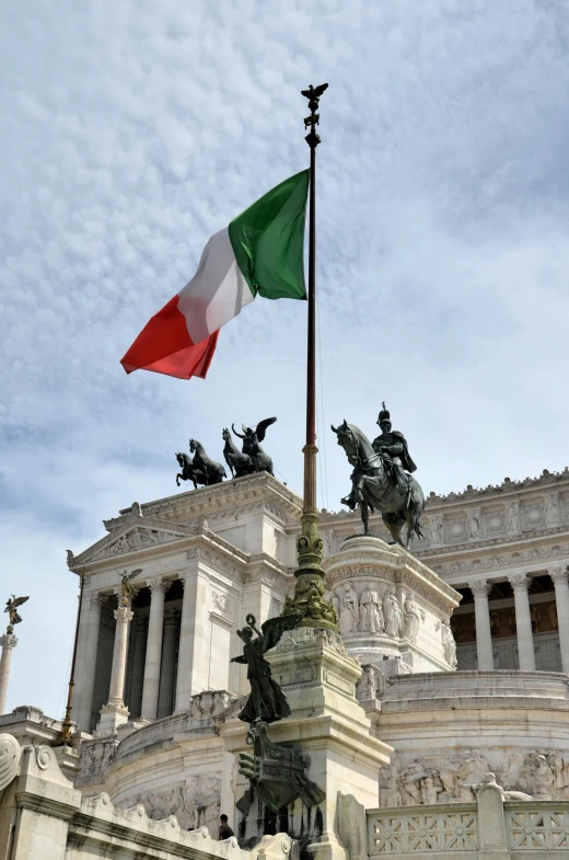 a flag on a pole in front of a building, a statue, by Vincenzo Cabianca, pexels contest winner, neoclassicism, square, color image, italian flag, in 2 0 1 5