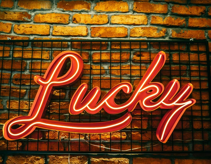 a neon sign that says lucky on a brick wall, pexels, 🦩🪐🐞👩🏻🦳, profile image, background image, urban decay