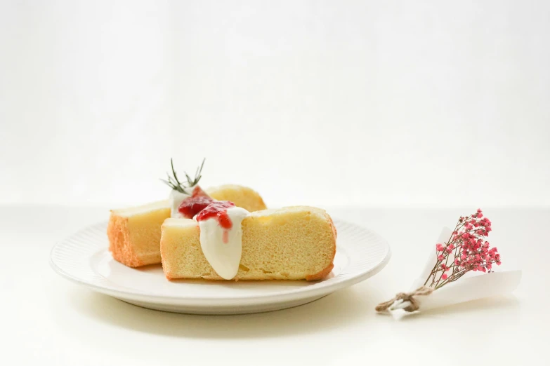 a piece of cake sitting on top of a white plate, by Tsuruko Yamazaki, unsplash, cream white background, cone, white red, flan