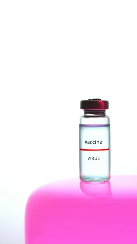 a bottle of vaccine sitting on top of a pink object, by Rachel Reckitt, shutterstock, high key detailed, square, ny, virus