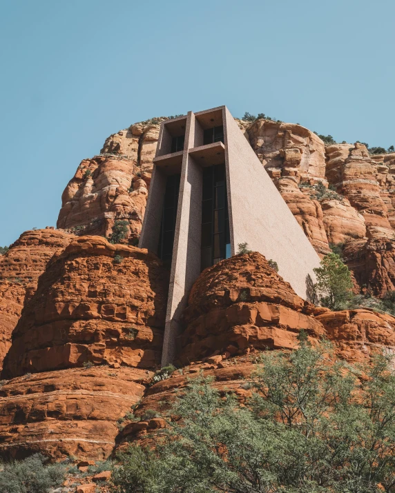 a church built into the side of a mountain, by Morgan Russell, unsplash contest winner, modernism, lgbtq, arizona, instagram story, college