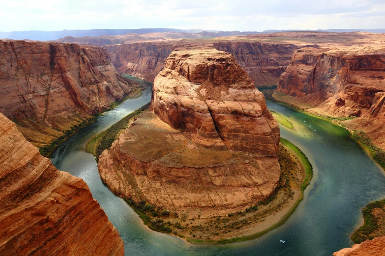 a view of a river running through a canyon, pexels contest winner, hurufiyya, cinematic still of westworld, sandstone, cosmopolitan, ariel view