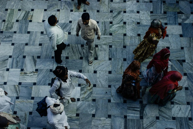 a group of people standing on top of a tiled floor, pexels contest winner, india, square lines, thumbnail, low colour