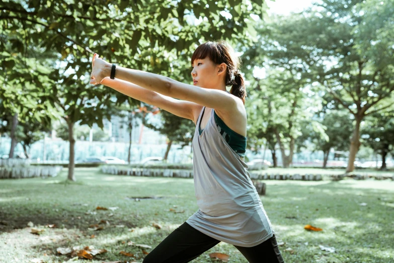 a woman holding a baseball bat in a park, by Bernardino Mei, pexels contest winner, marjaryasana and bitilasana, avatar image, square, sport bra and shirt