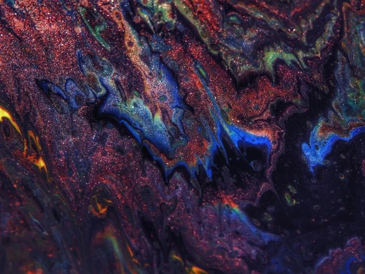 a close up of a liquid substance on a surface, inspired by Attila Meszlenyi, trending on pexels, space art, multicolored, dark paint, alien skin, colorful ravine