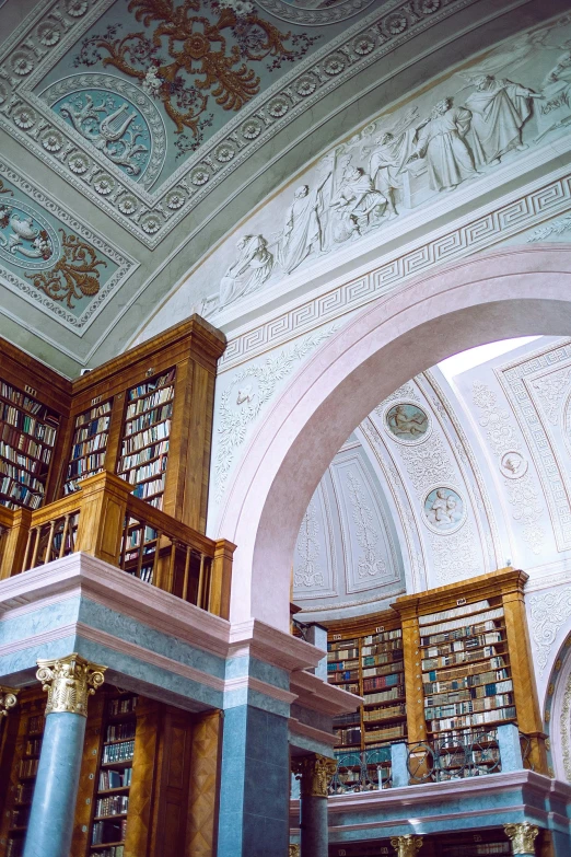 a large library filled with lots of books, by Harry Haenigsen, neoclassicism, helsinki, high arched ceiling, pastel, tundra