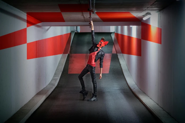 a man holding a baseball bat in a tunnel, inspired by Jodorowsky, pexels contest winner, female dancer, red - black, outfit photograph, rectangle