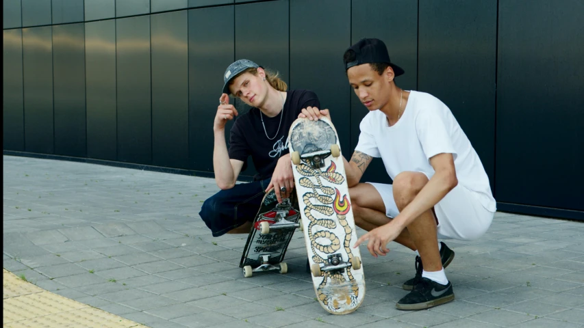 a couple of men sitting next to each other with a skateboard, pexels contest winner, realism, skin : tjalf sparnaay, college, standing on a skateboard, brock hofer