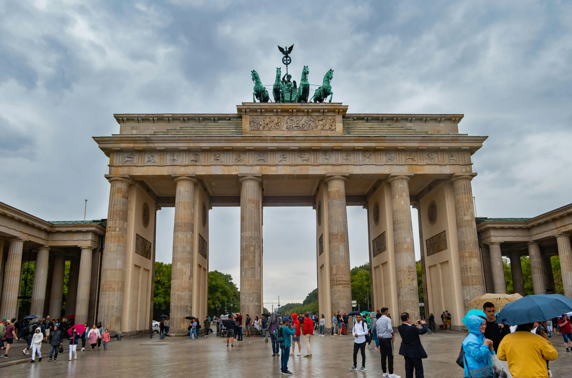 a group of people standing in front of a building, pexels contest winner, berlin secession, avatar image, an archway, high quality image