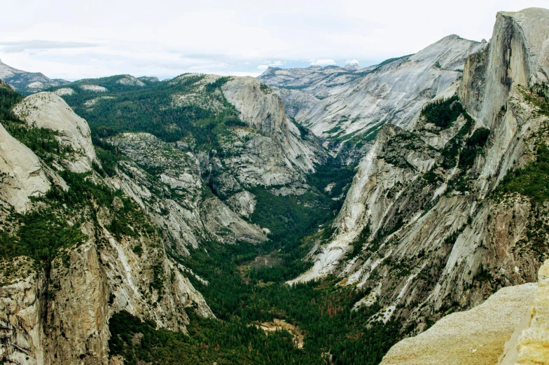 a view of the valley from the top of a mountain, by Kristin Nelson, pexels contest winner, yosemite valley, 2000s photo, panels, landslides