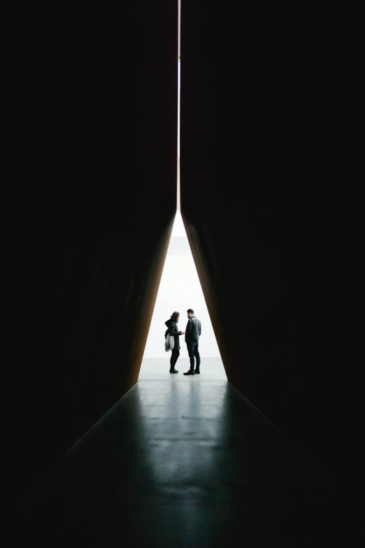 two people standing in front of a light at the end of a tunnel, by Thomas Fogarty, angular minimalism, washington dc, overlooking, deep love