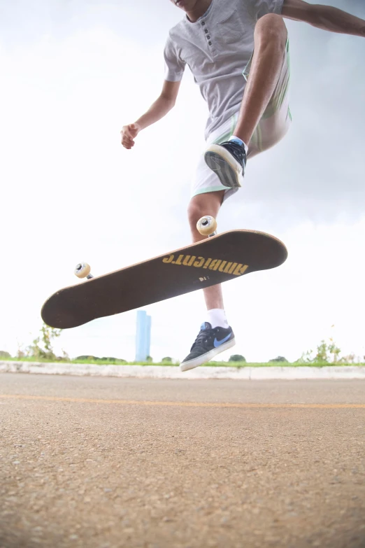 a man flying through the air while riding a skateboard, a picture, unsplash, hyperrealism, low quality footage, wide shot!!!!!!, thawan duchanee, shows a leg