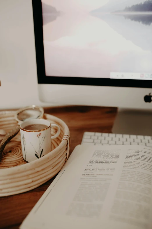 a computer monitor sitting on top of a wooden desk, by Carey Morris, trending on pexels, the sacred cup of understading, on a wooden tray, perfect readability, ( 3 1