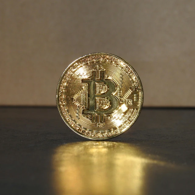 a bit coin sitting on top of a table, walking towards the camera