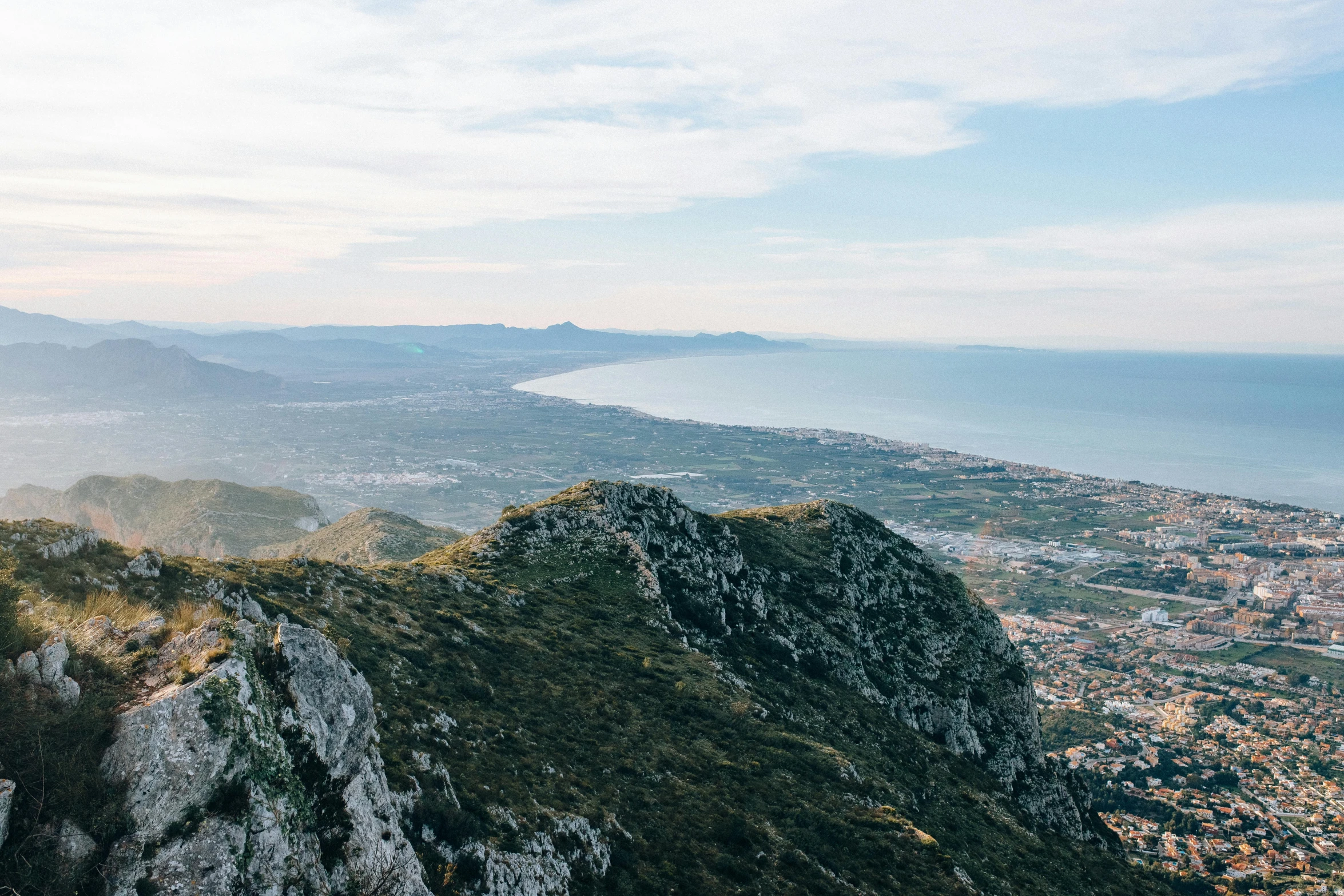 a person standing on top of a mountain, unsplash contest winner, les nabis, the city of santa barbara, seen from far away, mount olympus, three views