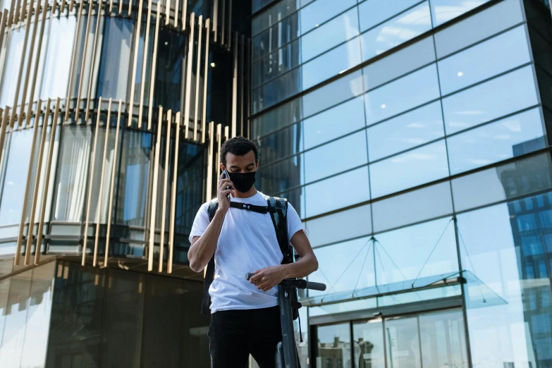 a man on a scooter talking on a cell phone, pexels contest winner, an arab standing watching over, university, avatar image, outdoor photo