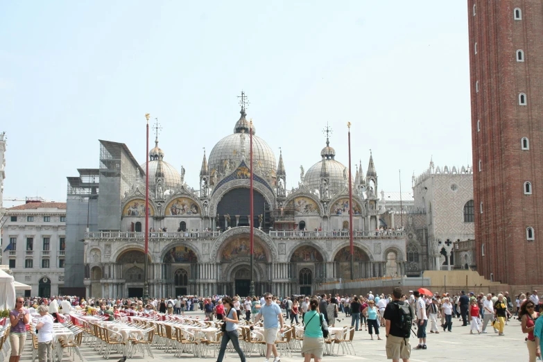 a crowd of people standing in front of a large building, an album cover, by Canaletto, pexels contest winner, renaissance, gondolas, alabaster gothic cathedral, food stalls, taken in the late 2010s
