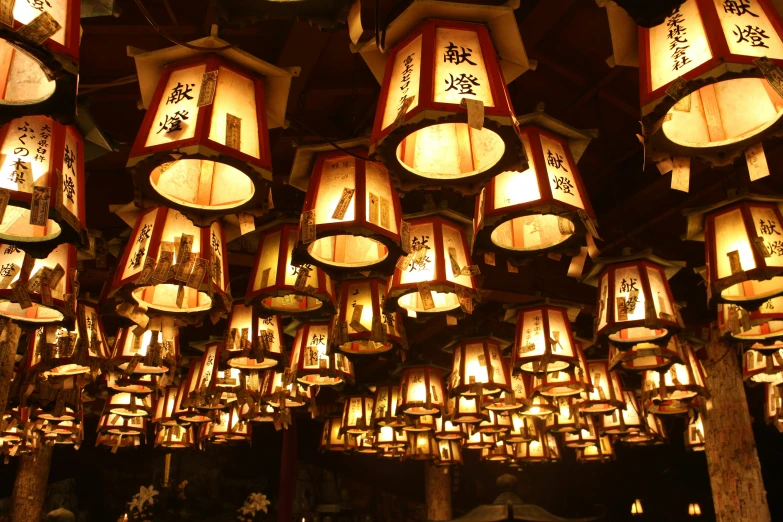 a room filled with lots of lamps hanging from the ceiling, a picture, inspired by Itō Jakuchū, trending on unsplash, sōsaku hanga, lantern candle, a mystical temple, brown, white